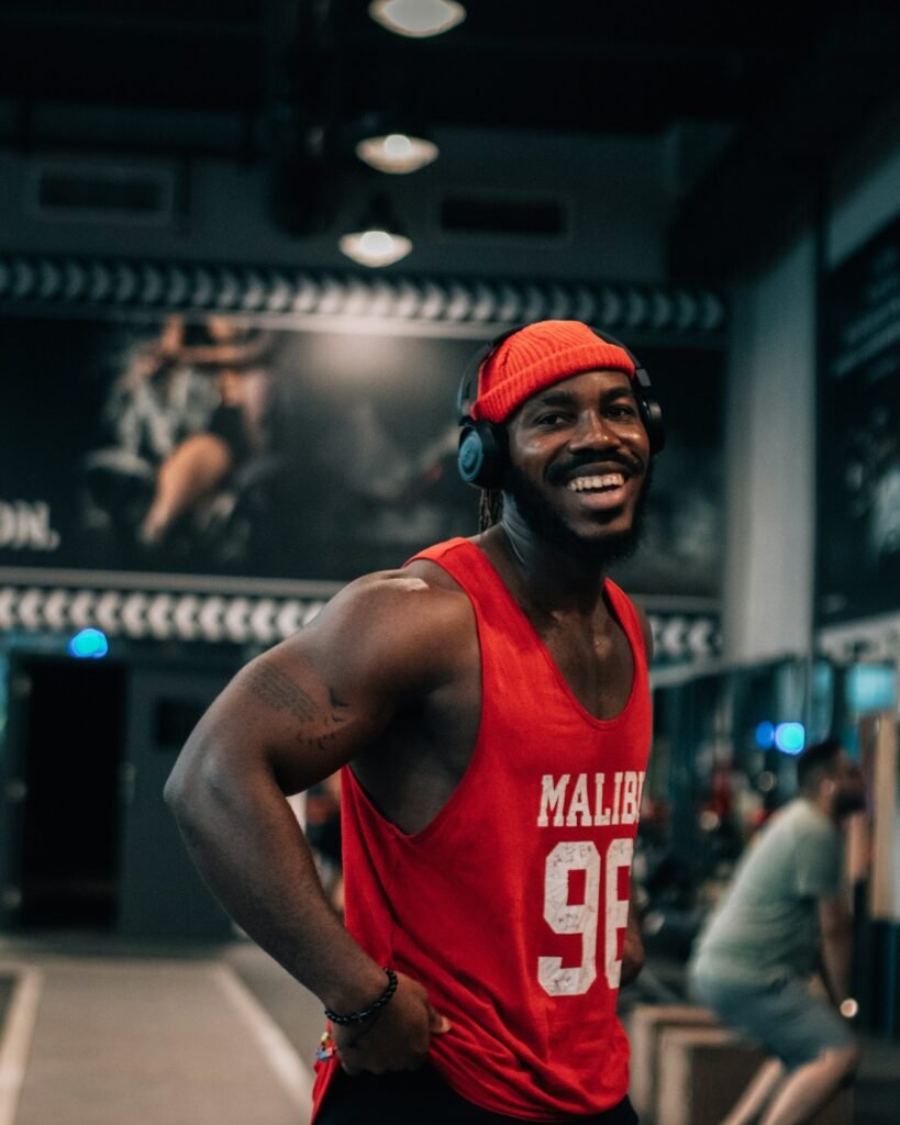 Smiling athlete training in the gym