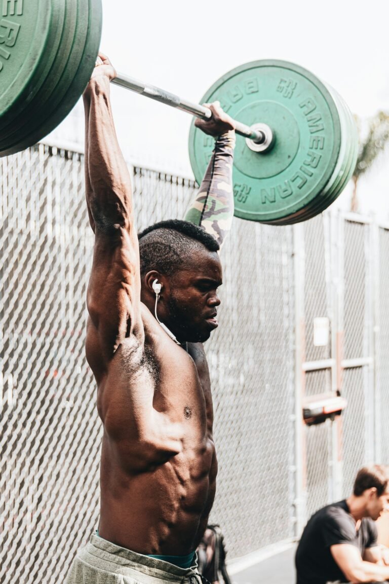 Man lifting a barbell overhead