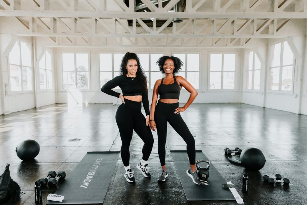 Two women ready to train in the gym